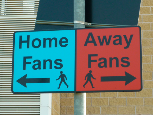 home and away fans sign